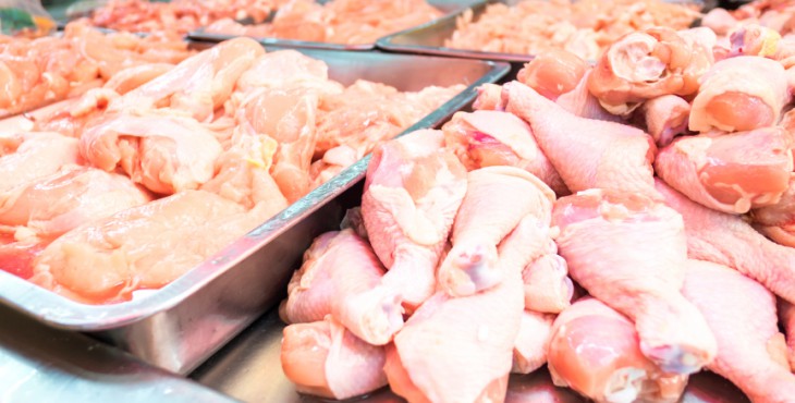 CLose up raw chicken meat on counter at fresh market