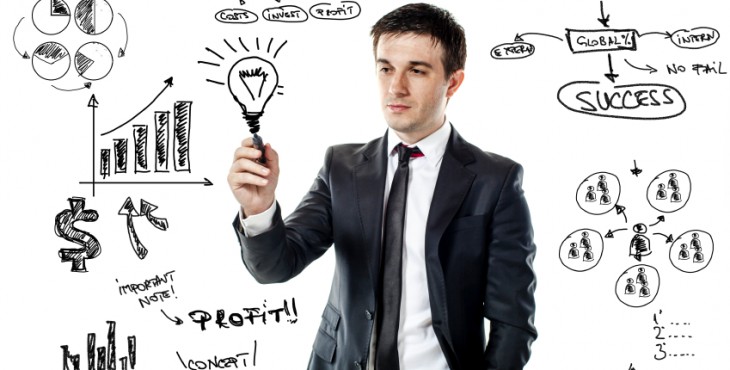 businessman drawing a virtual business plan