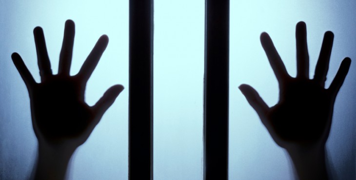 The silhouette of the hand on glass