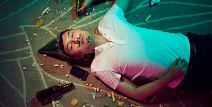 Man sleeping on the floor after party