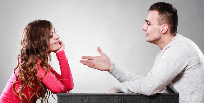 Man trying to reconcile with woman after quarrel.