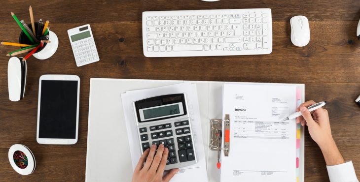 Businessperson Calculating Tax